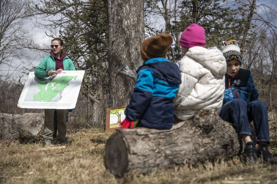 Alyssa Guritz of the Indian Creek Nature Center leads a group learning session on March 16 at the nature center in Cedar Rapids. Indian Creek Nature Center offers youth programming focused around the production and history of syrup. (Geoff Stellfox/The Gazette)