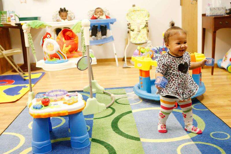 A child plays at the Home Ties Child Care Center in Iowa City in this 2021 photo. Child welfare advocates in the state point to the high cost, impact and inaccessibility of child care for middle class families as a key focus for legislators in the 2024 session. (The Gazette)