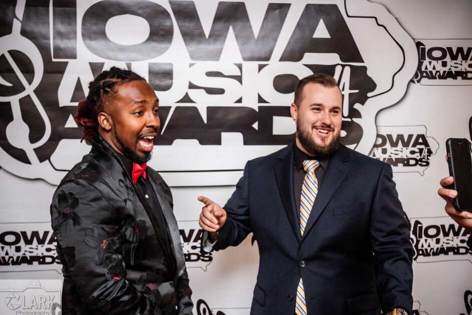 Antonio "Tone Da Boss" Chalmers (left) and Derek "Silence" Hennessey pose for photos during the Iowa Music Awards in 2022. Chalmers and Hennessey are cofounders of T1 Entertainment, which put on the event. (Submitted by T1 Entertainment)
