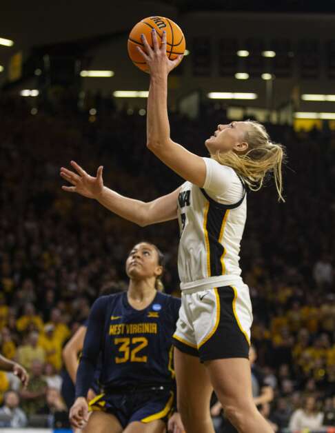 Iowa’s Sydney Affolter (3) converts the go-ahead layup with 2:03 remaining in the Hawkeyes’ 64-54 win over West Virginia in the second round of the NCAA women’s basketball tournament Monday at Carver-Hawkeye Arena. (Savannah Blake/The Gazette)