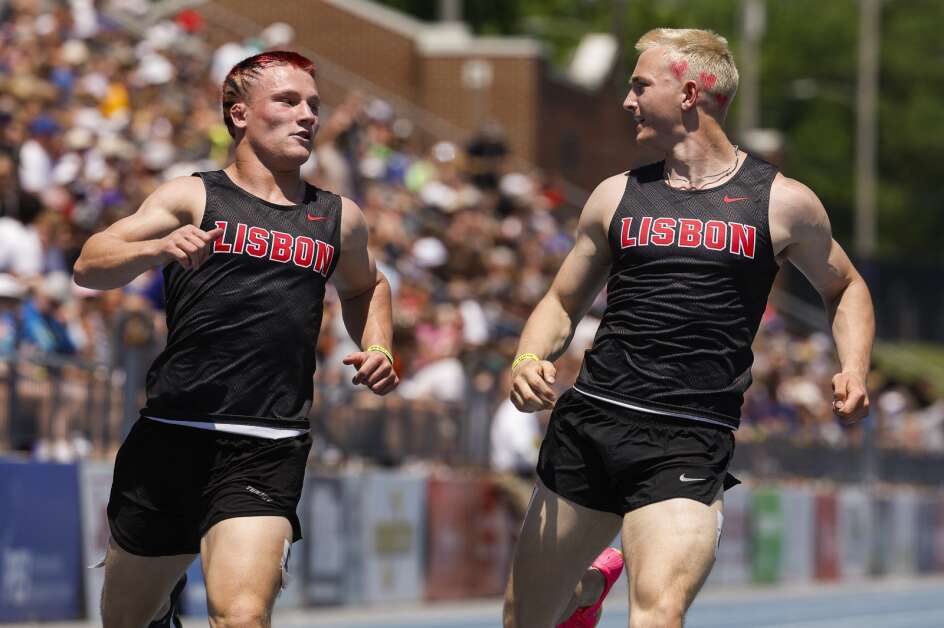Lisbon’s Baylor Speidel (right) celebrates with teammate Tiernan Boots after a 1-2 finish in the 1A 100-meter run during the 2024 Iowa High School State Track & Field Championships at Drake Stadium in Des Moines, Iowa, on Saturday, May 18, 2024. Speidel at 10.96; Boots at 10.98 sec.   (Jim Slosiarek/The Gazette)