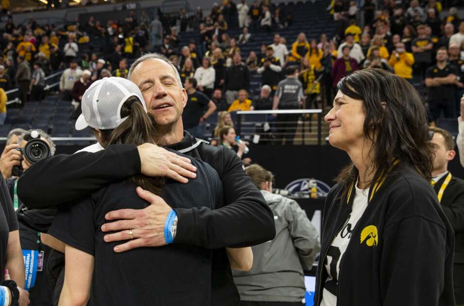Anne Nizzi-Clark watches as Brent Clark hugs his daughter Iowa Hawkeyes guard Caitlin Clark (22) after the Hawkeyes defeated Nebraska in overtime during the Big Ten Tournament championship game at Target Center in Minneapolis, Minnesota on Sunday, March 10, 2024. (Savannah Blake/The Gazette)