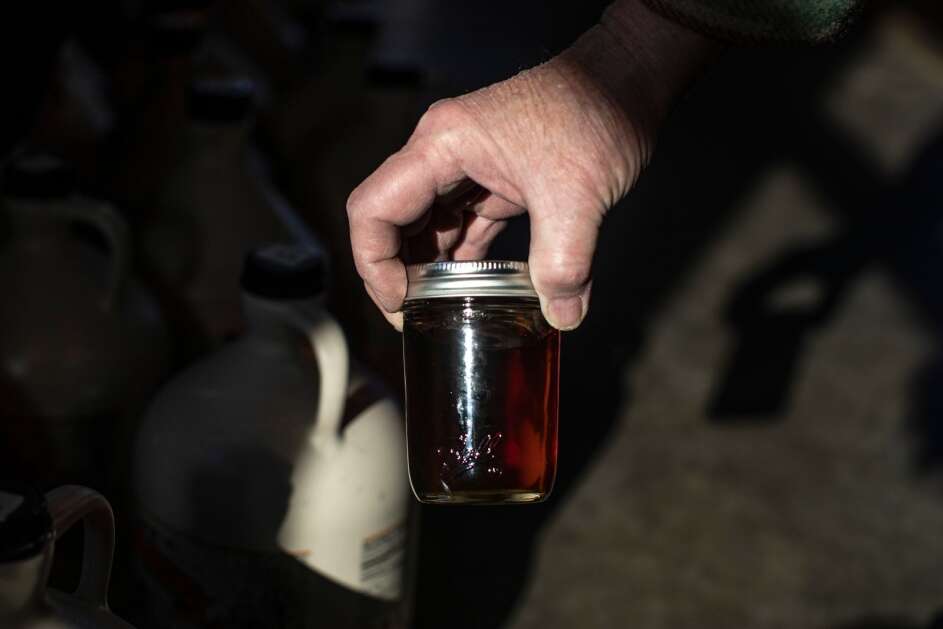A jar of the finished product of maple syrup on March 17, 2023, at Indian Creek Nature Center in Cedar Rapids. (Geoff Stellfox/The Gazette)