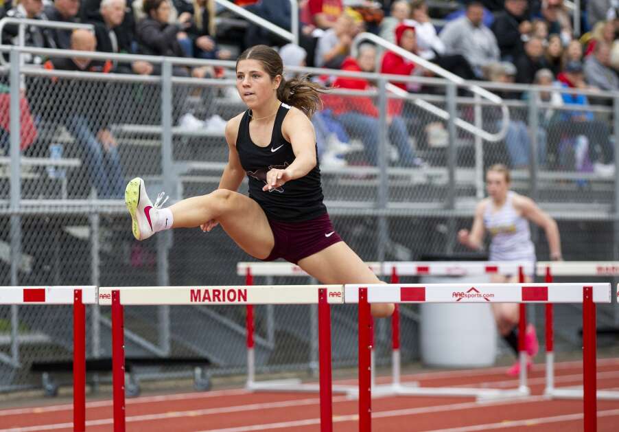 Mount Vernon’s Kiersten Swart competes in the Wamac Conference shuttle hurdle relay May 2. The Mustangs figure to finish in the top five in Class 3A at the state track and field meet this weekend in Des Moines. (Savannah Blake/The Gazette)