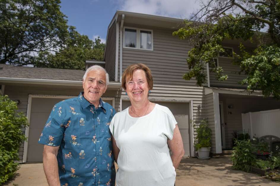 Dave and Linda Langston pose for a portrait outside their home in southeast Cedar Rapids on June 20. The couple struggled to find a new homeowners insurance policy after Pekin Insurance told them they were not renewing the policy for the homeowners association. (Savannah Blake/The Gazette)