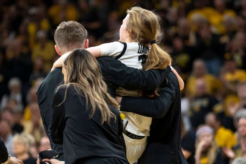 Iowa Hawkeyes guard Molly Davis (1) is carried off the court after an injury Sunday. (Geoff Stellfox/The Gazette)