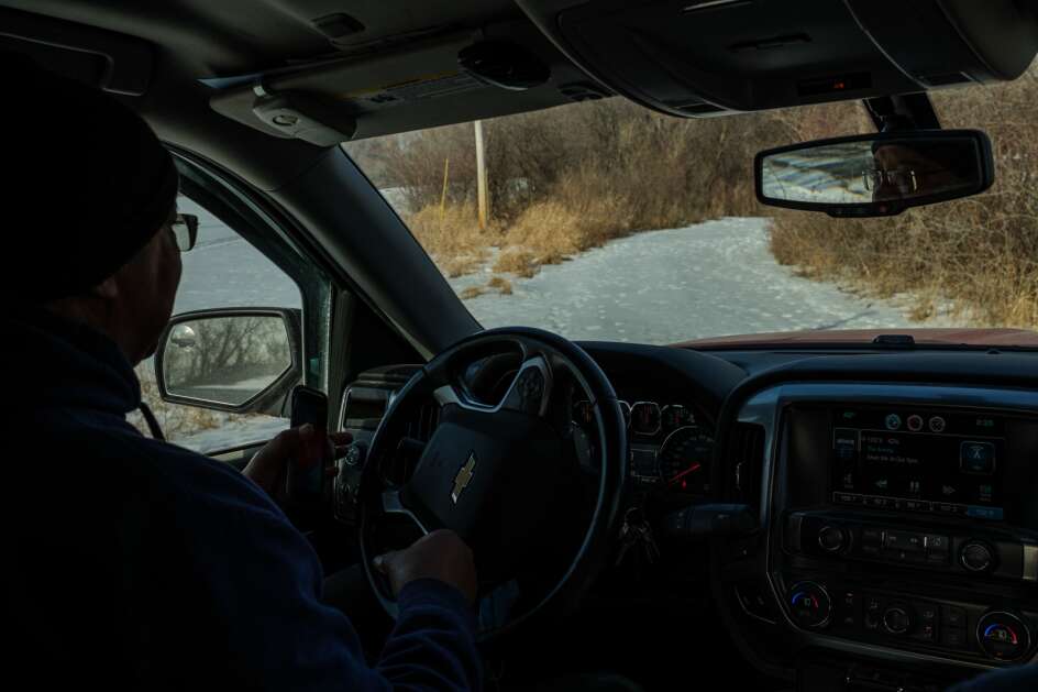 Mike Cook drives around his farm Feb. 8 near Waterloo. He farms multiple parcels of land in the area. (Nick Rohlman/The Gazette)
