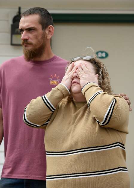 Sarah Schultz, the wife of Wall Lake truck driver David Schultz, cries while talking about the discovery of her husband's body during an April 25 news conference in Sac City. Consoling her at left is Jake Rowley of the United Cajun Navy, a group that had previously helped in the search for David Schultz’s body. (Tim Hynds/Sioux City Journal) 