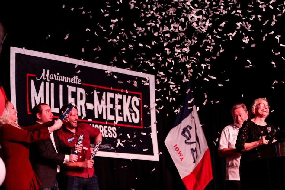 U.S. Rep. Mariannette Miller-Meeks, R-Iowa, celebrates with her family on stage at the Rhythm City Casino in Davenport on Tuesday, Nov. 8, 2022, after being re-elected to represent Iowa in the 1st Congressional District. She defeated state Rep. Christina Bohannan, D-Iowa City. (Nikos Frazier/Quad-City Times) 