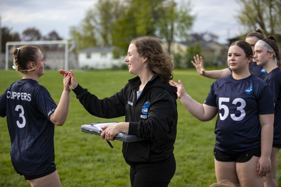 Clearcreek-Amana Middle School girls soccer coach Megan Johnson high-fives Teran Bishop during a soccer game against Vernon Middle School on the Marion High School field Tuesday.  (Nick Rollman/The Gazette)