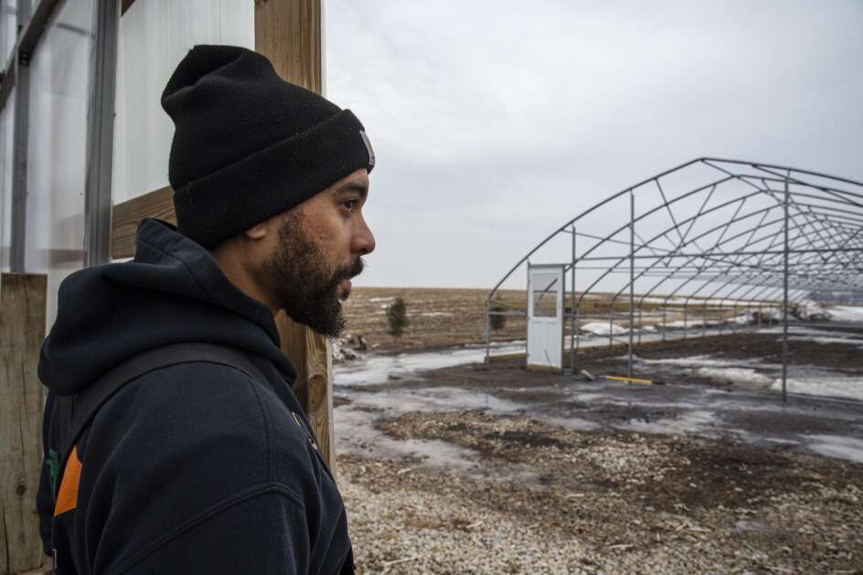 T.D. Holub, one of the few Black farmers in Iowa, looks over a partially completed high-tunnel greenhouse at his farm in Buchanan County. He’s planning to increase production of the vegetables he and his wife grow and sell locally. (Nick Rohlman/The Gazette)