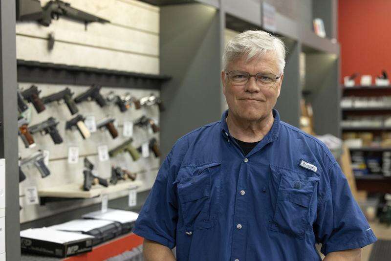 Maxon Shooter's Supplies owner Dan Eldridge poses in his store in Des Plaines, Ill., June 25. A new national divide is emerging among states over whether to track sales by gun stores. A California law taking effect Monday will require credit card networks to provide banks with special retail codes to assign to gun stores. By contrast, new laws taking effect in Georgia, Iowa, Tennessee and Wyoming will prohibit the use of special gun shop codes in financial transactions. A total of 17 states have passed some sort of limit on category codes for gun retailers, while California has been joined by Colorado and New York. (AP Photo/Teresa Crawford)