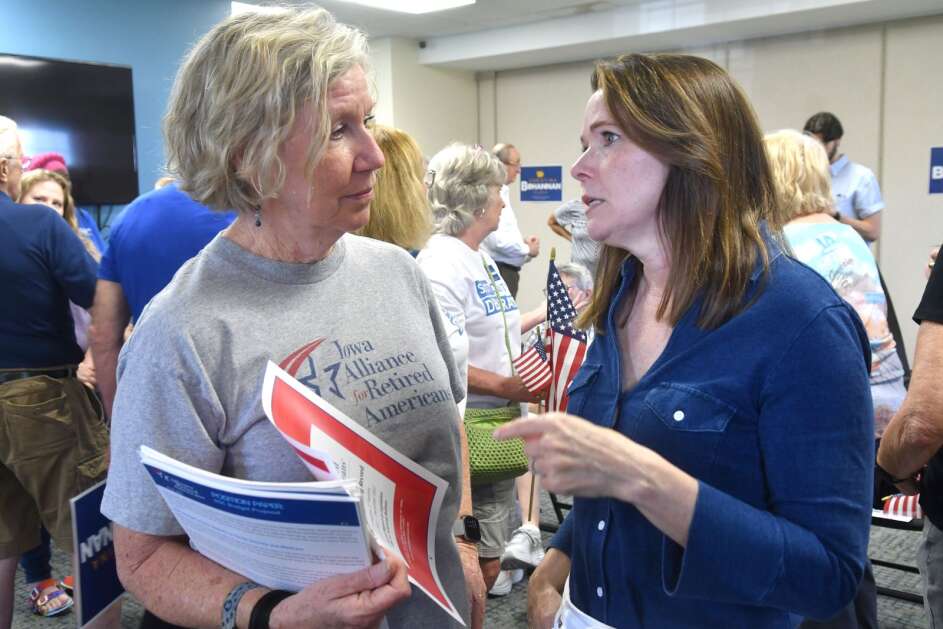 Kay Pence of Eldridge talks with Christina Bohannan, Democratic candidate for Iowa's 1st Congressional District, during a kick off of her campaign Tuesday at the UFCW Union hall in Davenport. (Gary L. Krambeck/Quad-City Times)