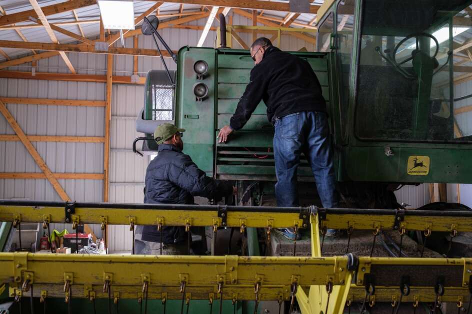 Christopher and Todd Western look over equipment Feb. 8 and discuss the repairs needed before the next growing season at their family’s farm near Waterloo. (Nick Rohlman/The Gazette)