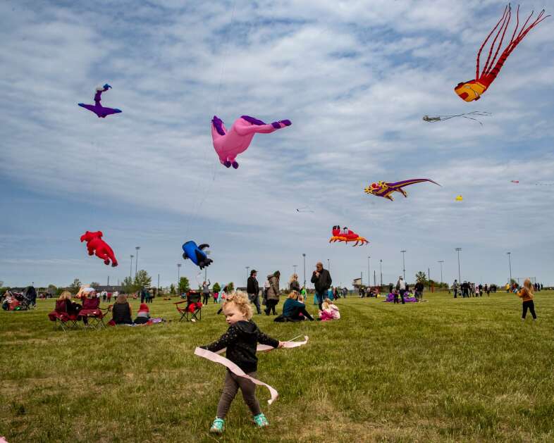 Rowan Nash, 2, of Marion, waves a streamer during the Marion Community Kite Festival in May 2022 at Lowe Park in Marion. The park now has free ImOn Wi-Fi. (Nick Rohlman/The Gazette)