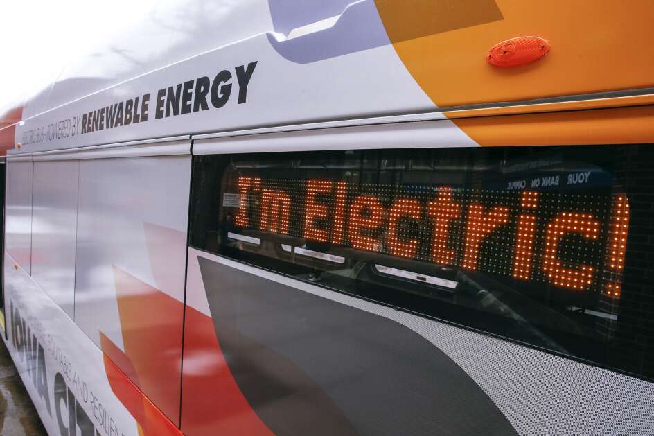 A sign on an electric bus is seen Jan. 27, 2022, as the bus makes a stop next to Old Capitol Town Center in downtown Iowa City. (Jim Slosiarek/The Gazette)