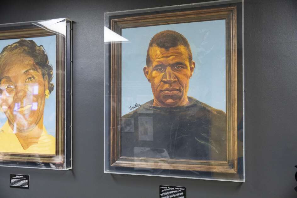 A portrait of football player Frederick Wayman “Duke” Slater painted by Harold Bradley Jr. is displayed during an April 12 ceremony celebrating the opening of a permanent exhibit honoring Bradley Jr. at the Iowa Memorial Union in Iowa City. (Nick Rohlman/The Gazette)