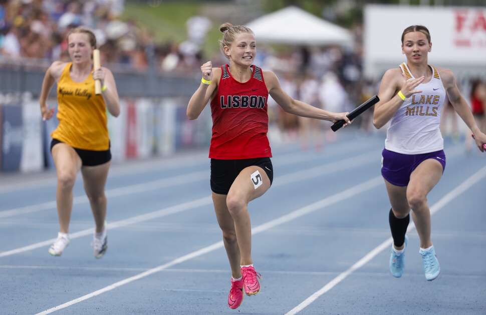 Lisbon anchor runner Addy Happel smiles as she crosses the finish line, securing the win for the Lions in the 1A 4 x 100-meter relay during the 2024 Iowa High School State Track & Field Championships at Drake Stadium in Des Moines, Iowa, on Saturday, May 18, 2024. The Lions won in 50.06. (Jim Slosiarek/The Gazette)





