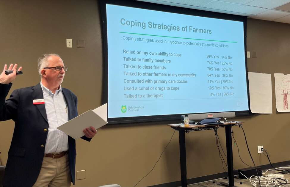 David Brown, a marriage and family therapist who works for Iowa State University Extension and Outreach, leads a training for psychologists in Grinnell on how to deal with the mental stress of farmers. (Tony Leys/KFF Health News)