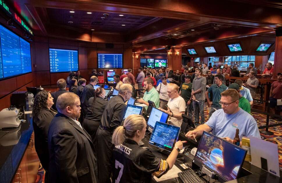 Bettors wager on sporting events Aug. 15, 2019, inside the sportsbook at Ameristar Casino Hotel in Council Bluffs. Gamblers no longer are required to go in-person to an Iowa casino to place sports bets, and can instead set up online accounts with approved sportsbooks. (Joe Shearer, Council Bluffs Nonpareil) 