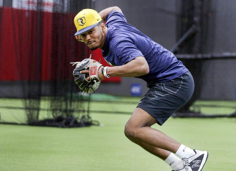 Iowa City Regina baseball player from Dominican Republic wants more than to  play pro ball