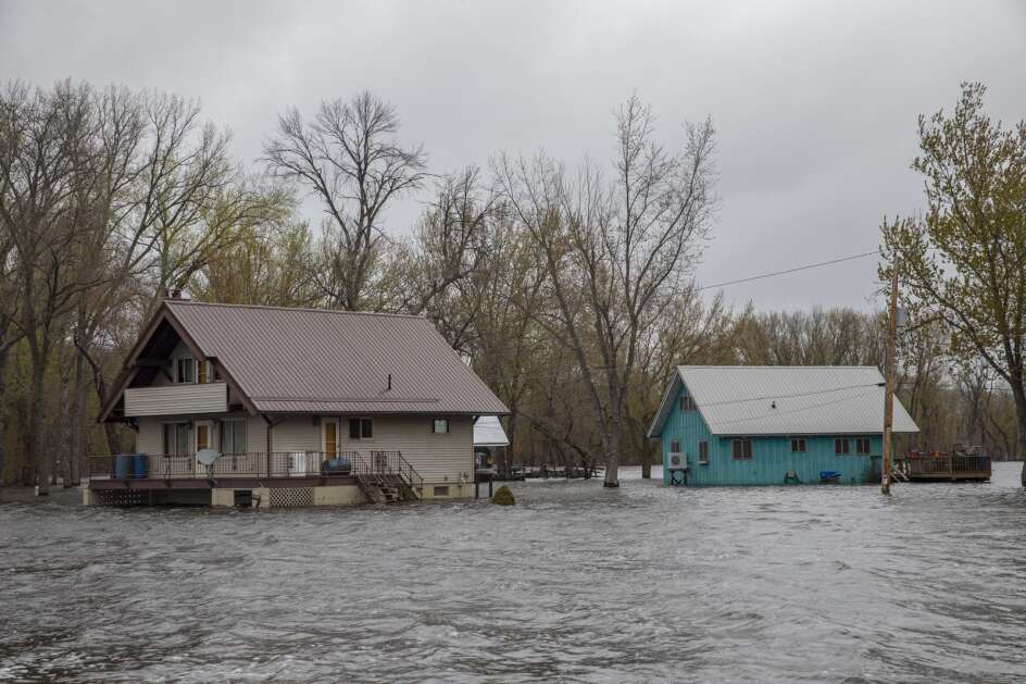 Mississippi River floodwaters surround cabins April 30 on Bergman Island near McGregor in northeast Iowa. The river crested at 22.91 in McGregor on April 28, the city’s third highest crest on record.  (Nick Rohlman/The Gazette)