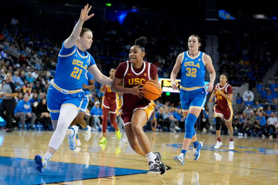 USC guard JuJu Watkins (center) drives to the basket as UCLA forward Lina Sontag (21) defends during their game Dec. 30. Both USC and UCLA will visit Carver-Hawkeye Arena for a women’s basketball game next season. (AP Photo/Marcio Jose Sanchez)