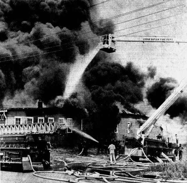 The Cedar Rapids Fire Department’s new double-boom aerial snorkel truck (above) was used for the first time May 22, 1964, to fight the fire that destroyed  the Cedar Rapids Transfer & Storage warehouse at 1201 Ninth St. SW. Thousands of people gathered to watch the fire, which sent billowing clouds of black smoke over the city. (Gazette archives) 