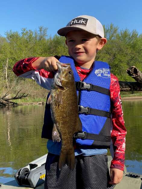 River Patterson, 7, of Atkins, poses with one of the many smallmouth bass he caught May 7 on an outing on the Wapsipinicon River. (Orlan Love/correspondent)