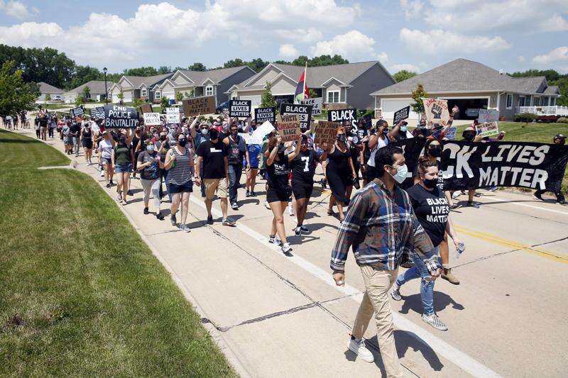 PHOTOS: Protesters rally, march to Cedar Rapids mayor’s house