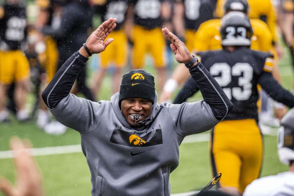 Iowa wide receivers coach Kelton Copeland signals for a touchdown during spring practice at Kinnick Stadium in Iowa City on Saturday, April 22, 2023. (Nick Rohlman/The Gazette)