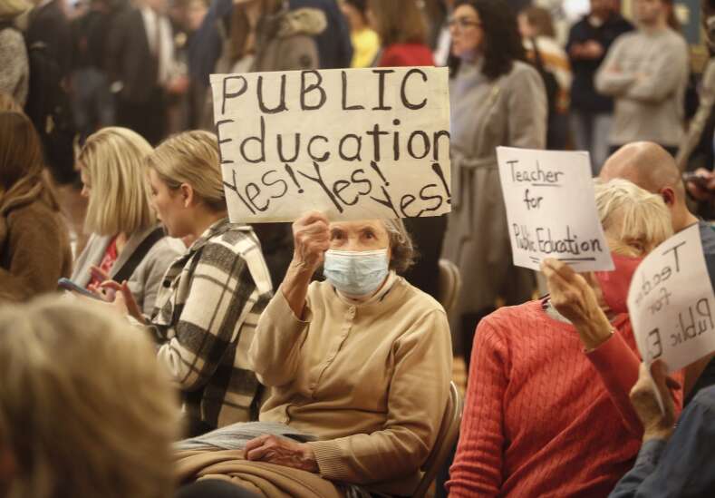 Scores of Iowans pack hearing on tuition aid bill