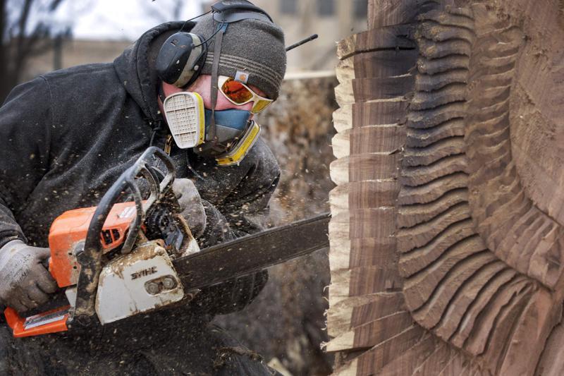 Chain saw artists carve beauty out of derecho destruction