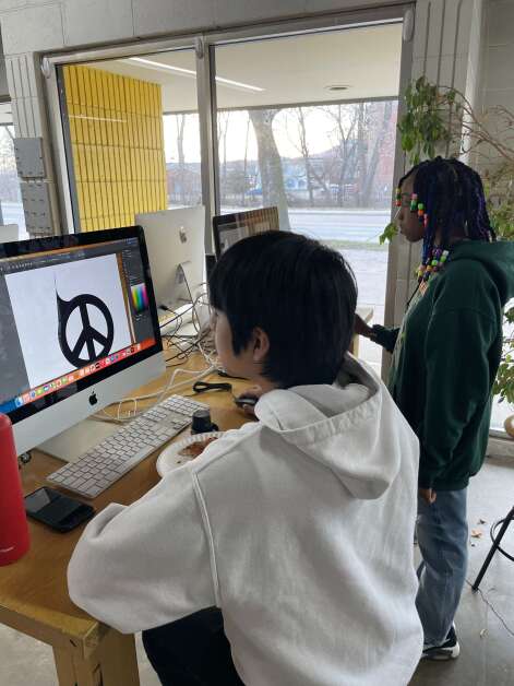 Wright House of Fashion students Hector Ramirez and Nuggett KaLar work on projects to help Atlantic Records celebrate the record label’s 75th anniversary. (Wright House of Fashion)