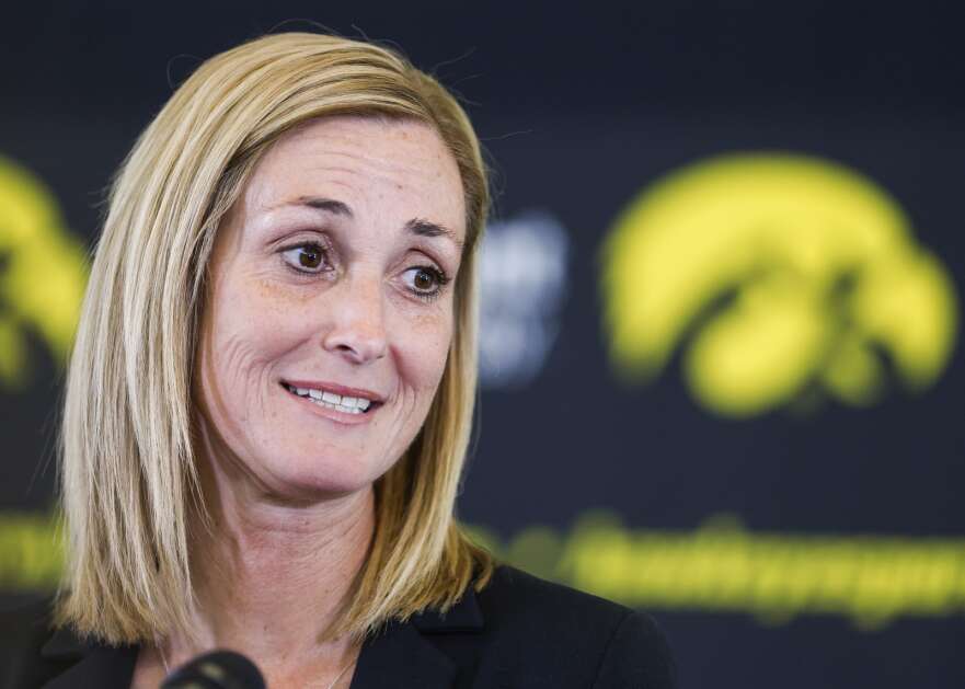 University of Iowa interim athletics director Beth Goetz answers reporters' questions Aug. 17 during a news conference for her official introduction at Carver-Hawkeye Stadium in Iowa City.  Goetz replaces Gary Barta, who retired on Aug. 1 after 17 years as athletics director.  (Jim Slusiarek/The Journal)