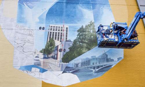 Swiss artist duo creates Cedar Rapids mural honoring ConnectCR project