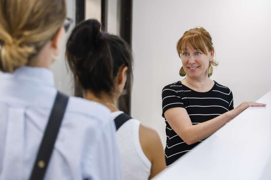 Leslie Nolte (right) shows the ICON Academy performing arts boarding school to Kathryn Edel (left) director of student life and Lisa Fender with Evolve Staging and Design during a walkthrough of the space in Iowa City, Iowa, on Friday, June 23, 2023. The project-based learning high school allows students to pursue 20 hours of art education while completing online academic courses from the Iowa City Community School District. The school is set to open  (Jim Slosiarek/The Gazette)