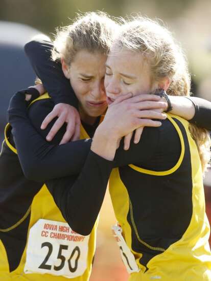 Mid-Prairie wins 2A girls’ cross country state title behind 1-2 finish from Marie and Anna Hostetler