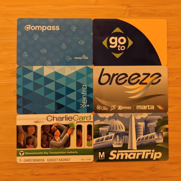 An incomplete collection of the author's public transit passes. From left-right, top-bottom: Compass (Vancouver), Go-To (Minneapolis-Saint Paul), Ventra (Chicago), Breeze (Atlanta), Charlie (Boston), SmarTrip (Washington, DC) 