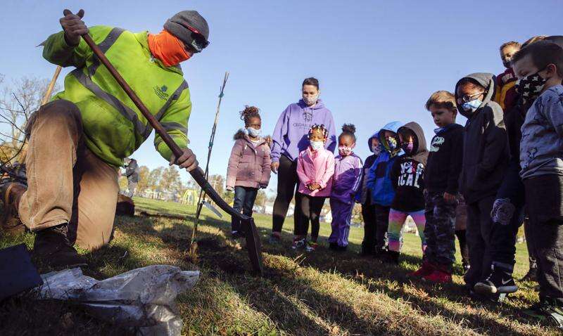 Cedar Rapids elementary students ‘plant hope’ with 6 apple trees in city park