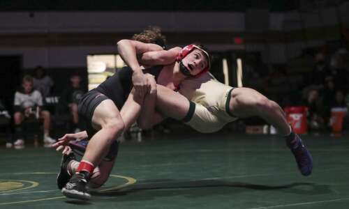 Photos: City High vs. Iowa City West wrestling dual