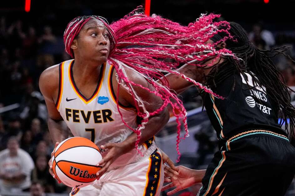 Indiana Fever forward Aliyah Boston (7) looks to shoot over New York Liberty forward Jonquel Jones (35) in the second half of a WNBA basketball game in Indianapolis, Wednesday, July 12, 2023. The Liberty defeated the Fever 95-87 in overtime. (AP Photo/Michael Conroy)