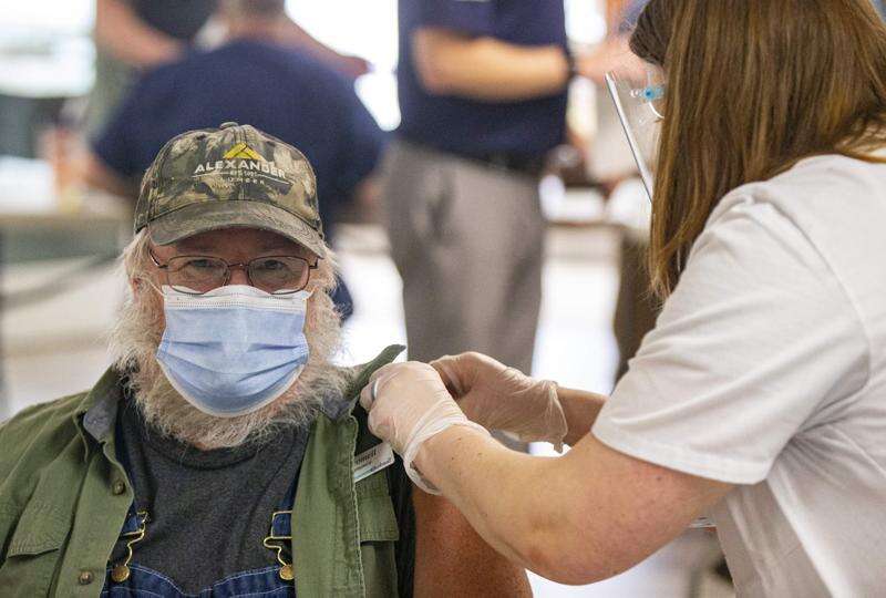 COVID-19 vaccines off to uncertain start in Iowa facilities