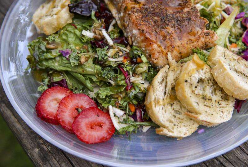 Pair heat and sweet with honey jerk salmon on a bed of greens