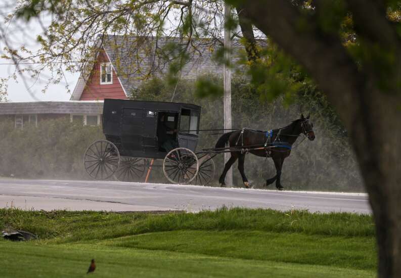 Shunning vaccines, Iowa Amish deal with COVID-19 as a community 