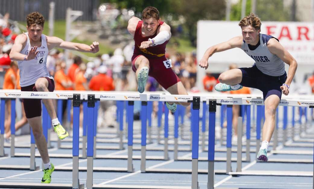 Cedar Rapids Xavier's Grayson Hartman clears the final hurdle on his way to winning the Class 3A boys’ state track and field 110-meter hurdles Saturday at Drake Stadium in Des Moines. (Jim Slosiarek/The Gazette)