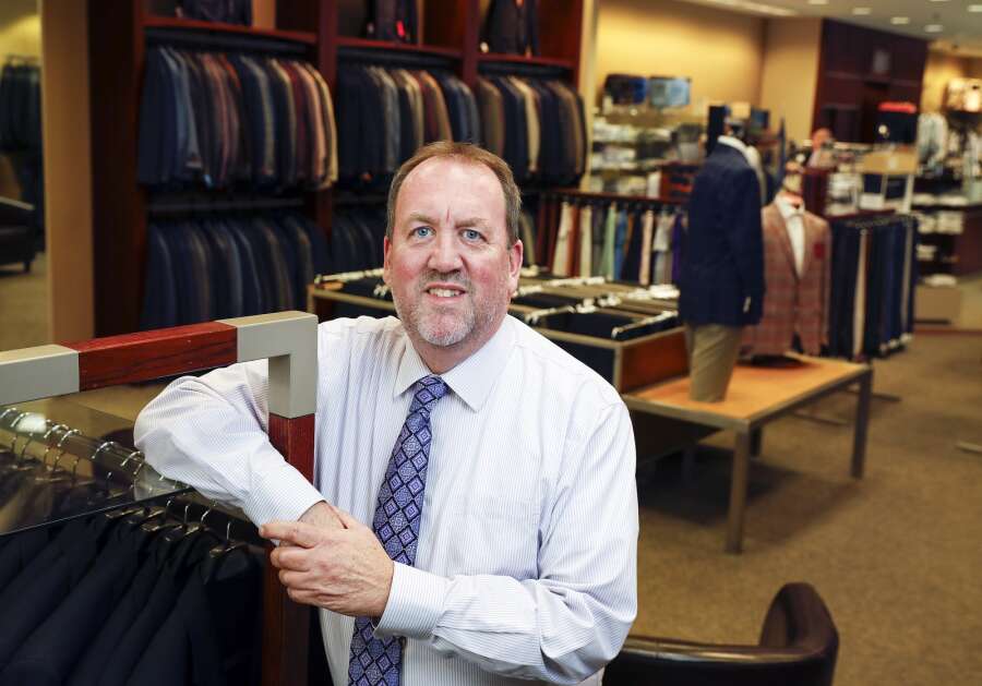 Sean Holley stands in his  Holley's Shop for Men at Lindale Mall in northeast Cedar Rapids. The store has been in Lindale for 59 years, he said, adding he is optimistic about the mall’s new owners. (Jim Slosiarek/The Gazette)
