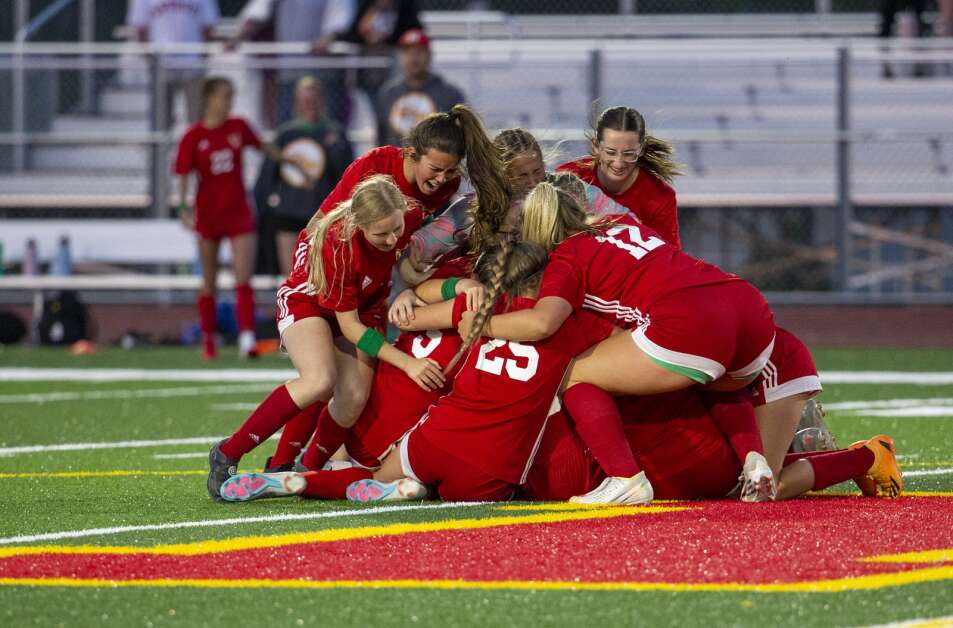 Wolves soccer players huddle together in celebration after defeating Liberty 3-2 to advance to state at Marion High School in Marion, Iowa on Thursday, May 25, 2023. (Savannah Blake/The Gazette)