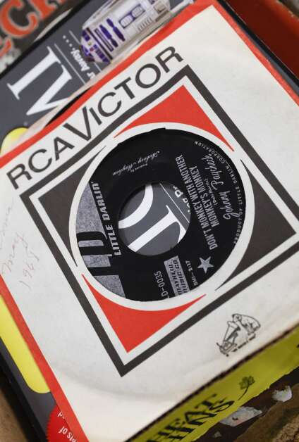 Vintage vinyl records are in one of the lots being auctioned at Sharpless Auctions, east of Iowa CIty. (Jim Slosiarek/The Gazette)