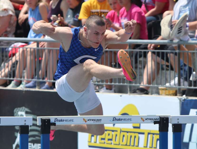 Columbus’ Riley Kaalberg goes over a hurdle during the Wildcats shuttle hurdles at the Iowa High School Track and Field Championship. The Wildcats finished third in the final. (Hunter Moeller/The Union)